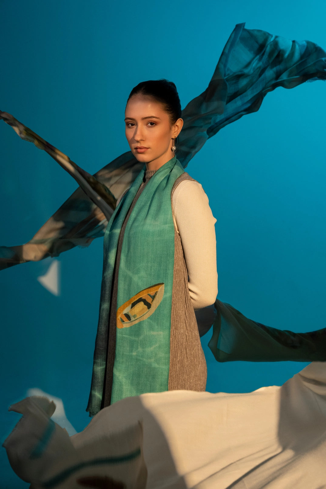 Elegant Merino wool and silk shawl draped over shoulders,perfect for women's evening wear