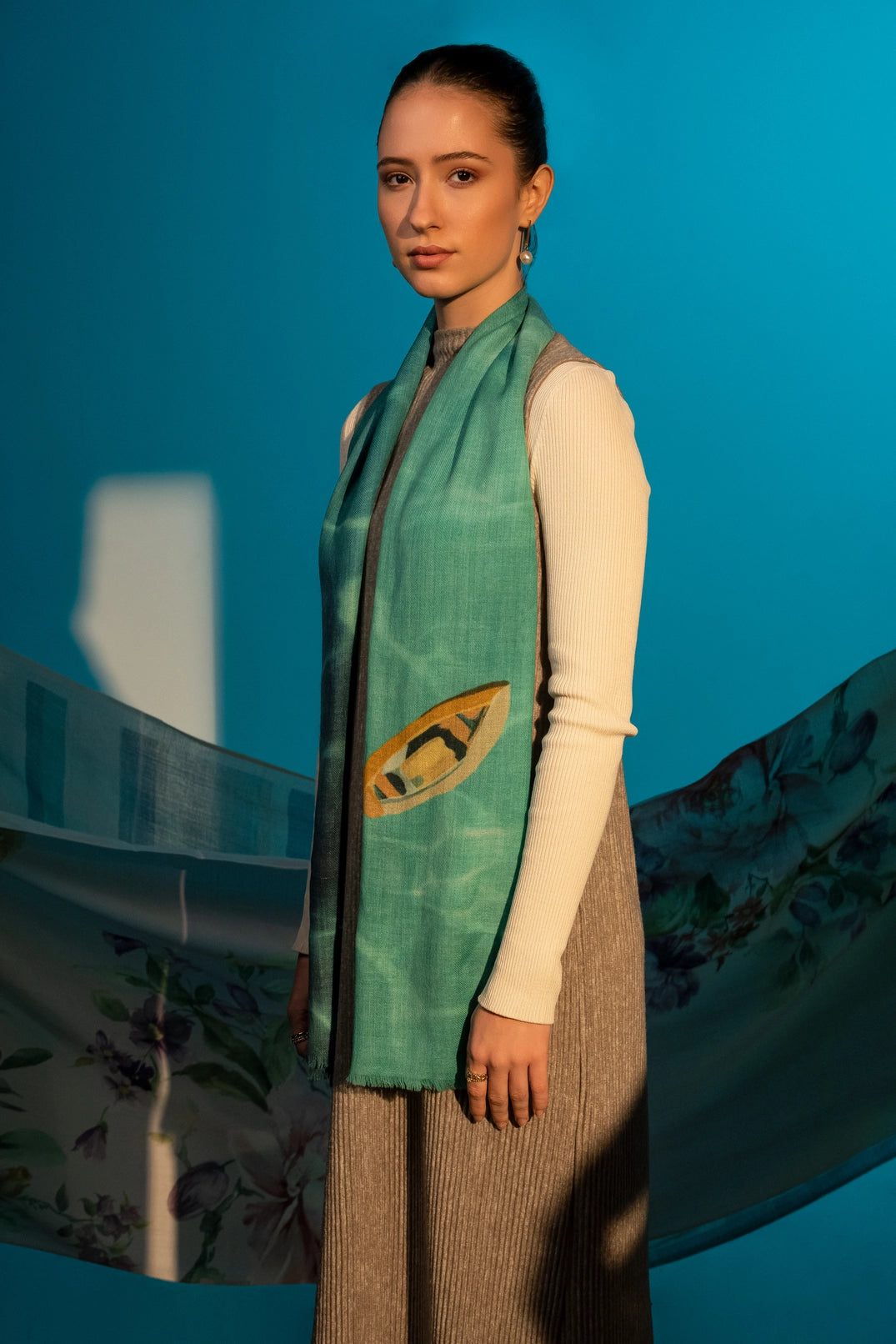 Elegant Merino wool and silk shawl draped over shoulders,perfect for women's evening wear