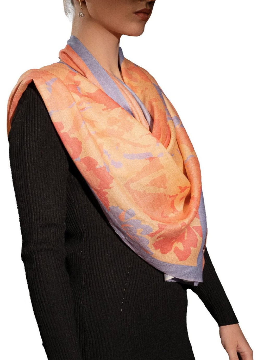 Elegant Merino wool and silk shawl draped over shoulders,perfect for women's evening wear