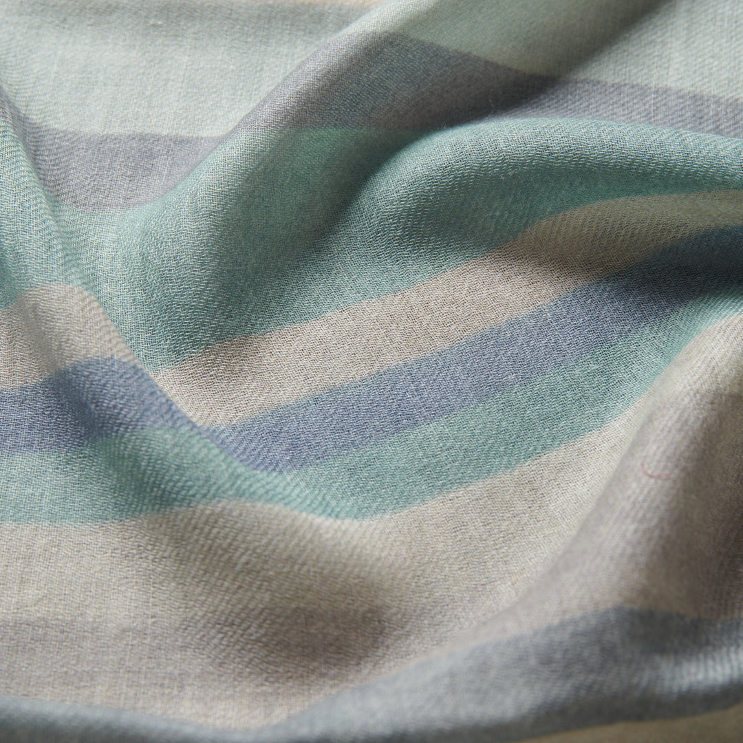 Elegant Merino wool and silk shawl draped over shoulders,perfect for women's evening wear