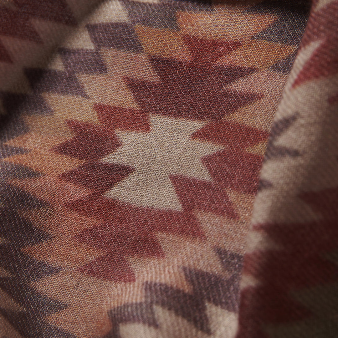 Elegant Merino wool and silk shawl draped over shoulders,perfect for women's evening wear