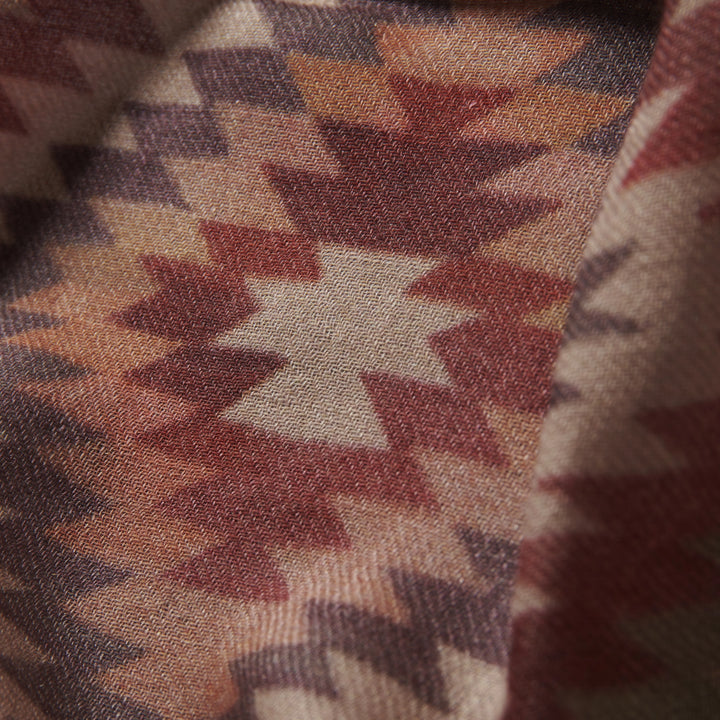 Elegant Merino wool and silk shawl draped over shoulders,perfect for women's evening wear