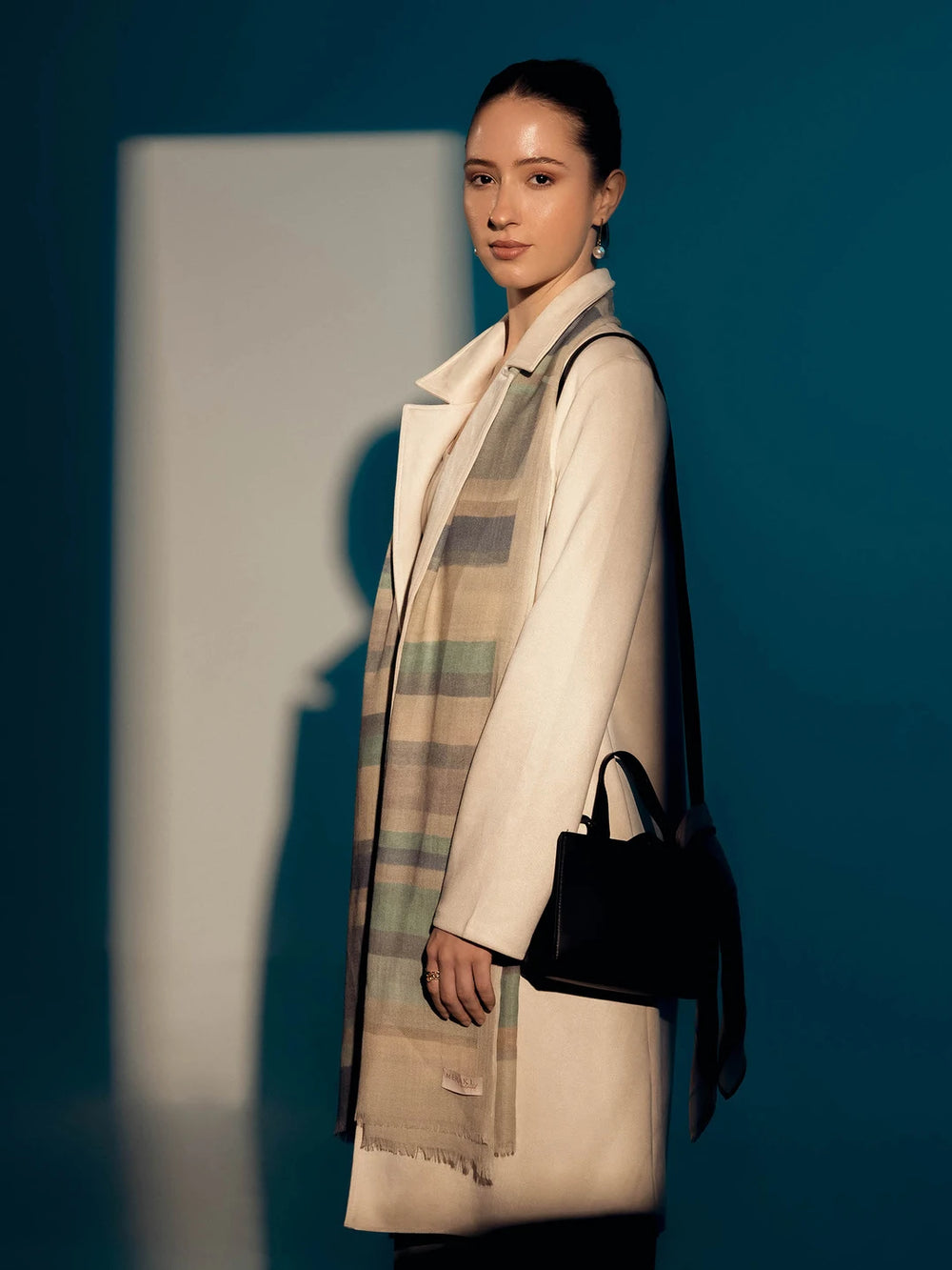 Elegant Merino wool and silk shawl draped over shoulders,perfect for women's evening wear