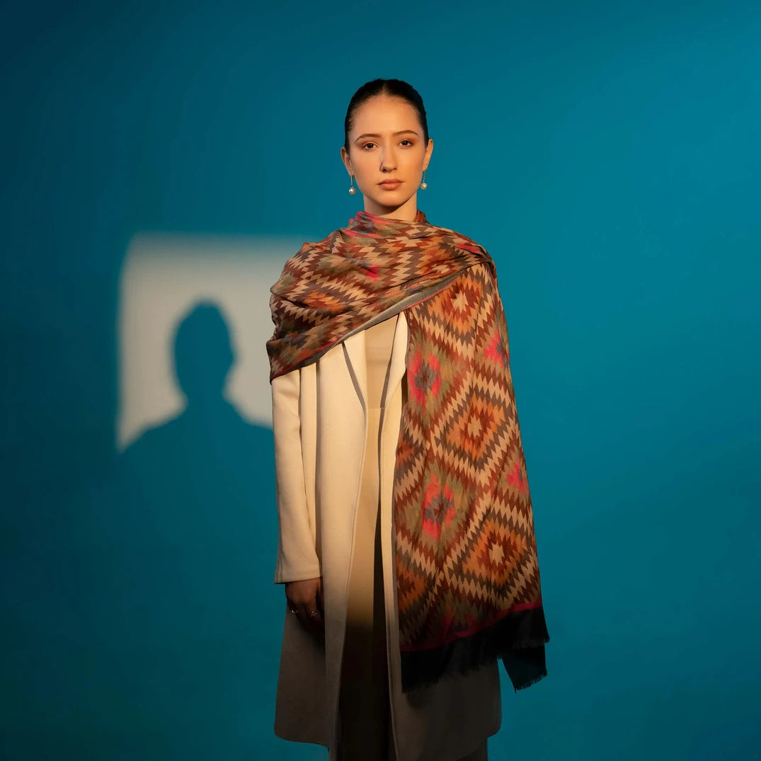 Elegant Merino wool and silk shawl draped over shoulders,perfect for women's evening wear