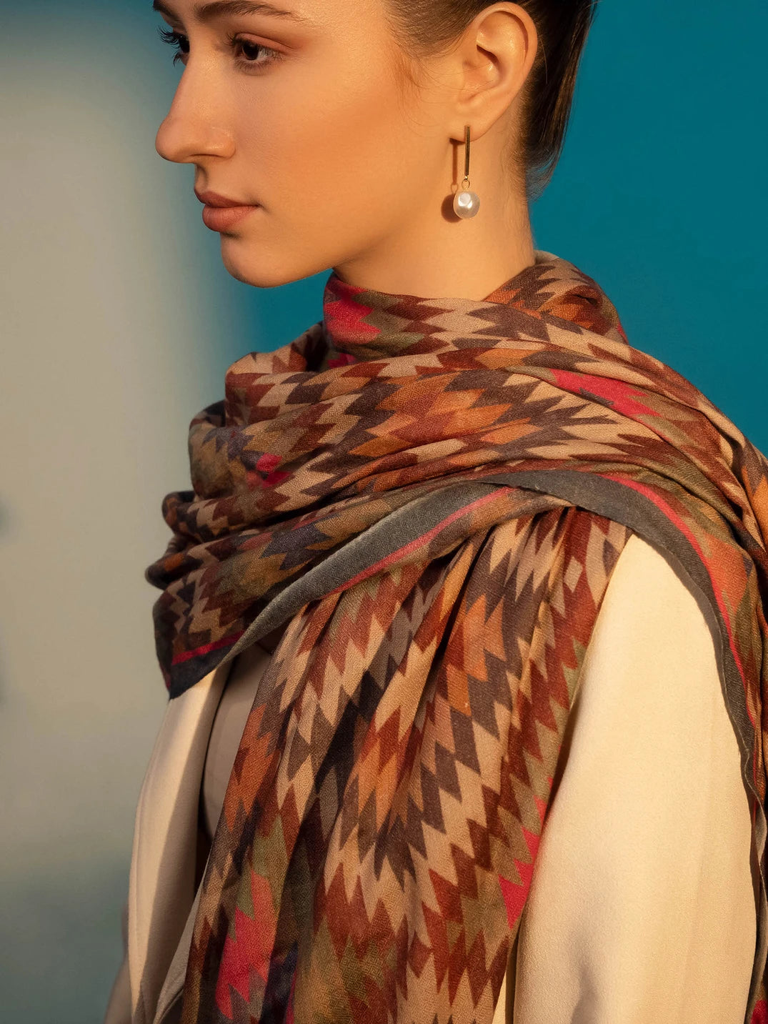 Elegant Merino wool and silk shawl draped over shoulders,perfect for women's evening wear